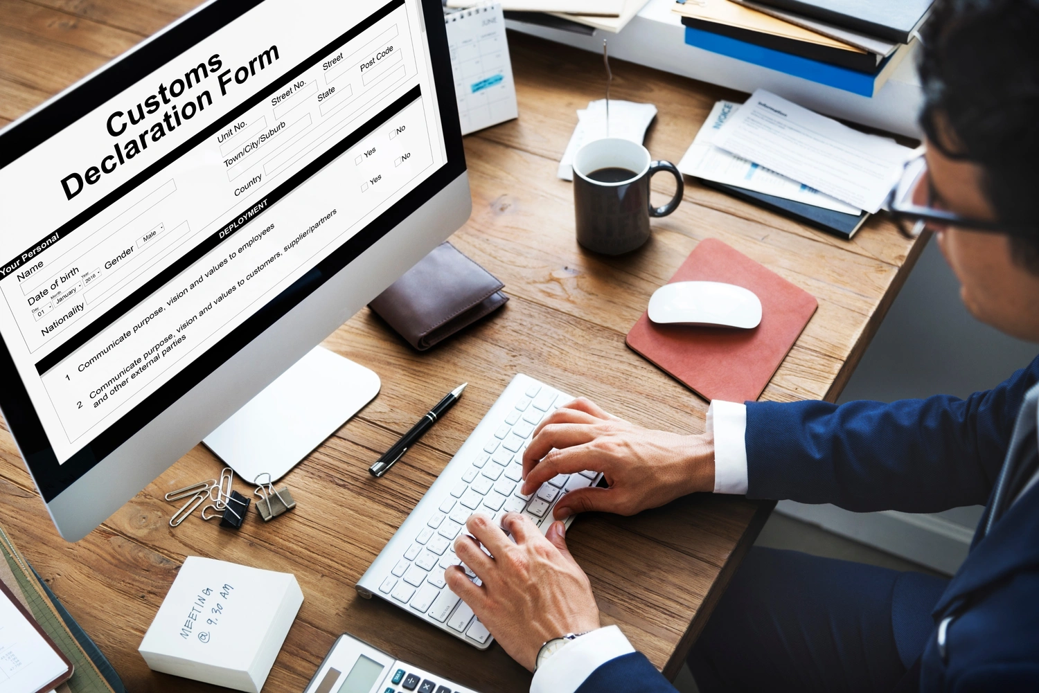 man handling custom declaration form in a computer