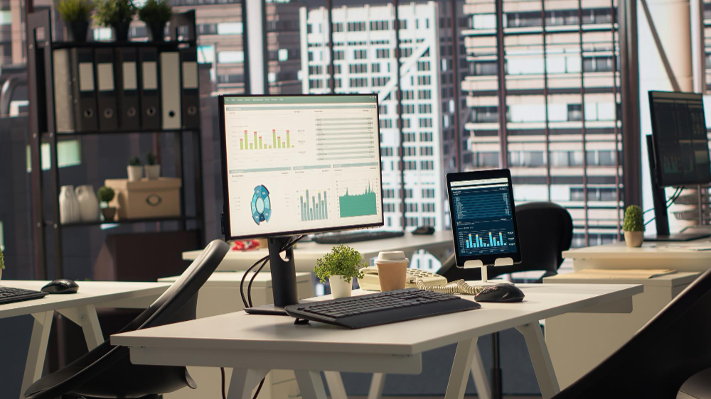 Modern financial trading desk setup with market data monitors for an accredited fund management company in Singapore